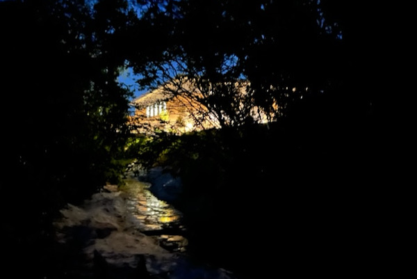 The glow of Bryan Adams High School brightly lit as seen from Leonard’s backyard. Photo by Kristi Kerr Leonard.