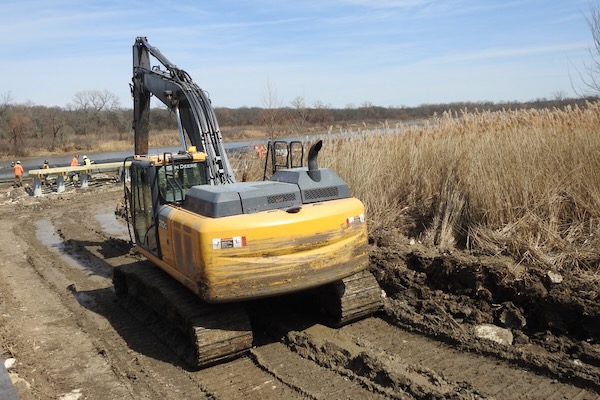 A large excavator making its way to the construction site. Photo by Michael Smith.