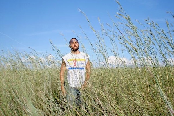 Jarid Manos amid bluestem