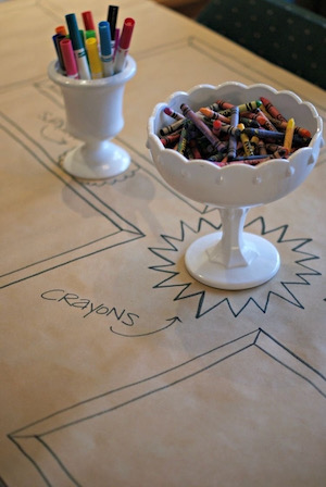 A children’s table features crayons and art supplies. Photo by Marjorie Lombard.