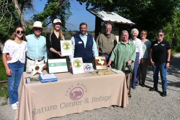 From left, Councilman Leonard Firestone's daughter, City Councilman Leonard Firestone, Sarah Adloo, Dave Lewis, Rob Denkhaus, Marsha McLaughlin (former president of Friends of Fort Worth Nature Center), Marty Leonard, Haily Summerford (executive director of Friends of Fort Worth Nature Center), and Kelli Pickard (deputy assistant director, Parks Department.) Photo by Michael Smith.