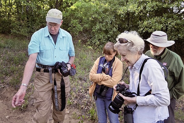 Jeff Quayle answers a question from members of the Friends of Sheri Capehart Nature Preserve in Arlington during a April plant survey in April. Photo by J.G. Domke.