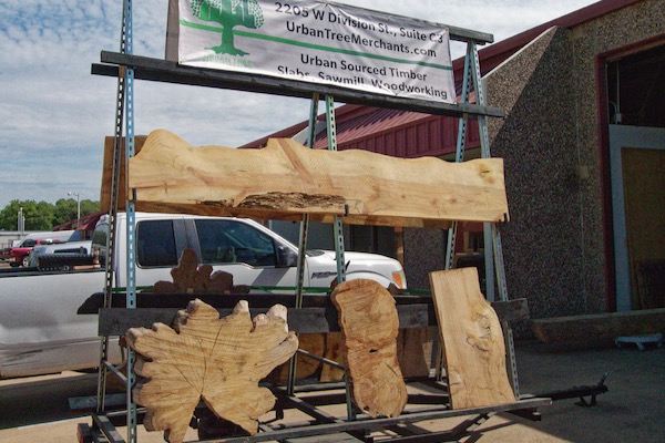 Caleb and Kelly Geer, owners of Urban Tree Merchants sell milled wood and home decor made from residential trees at their store in Arlington. Photo by J.G. Domke.