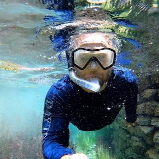 Chet snorkels at TNC's Independence Creek Preserve