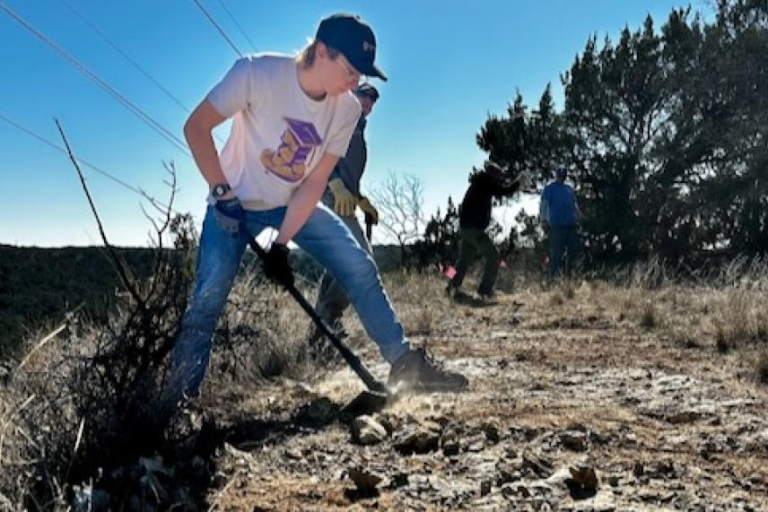 Participants level a trail at the Lone Star Trail Building School