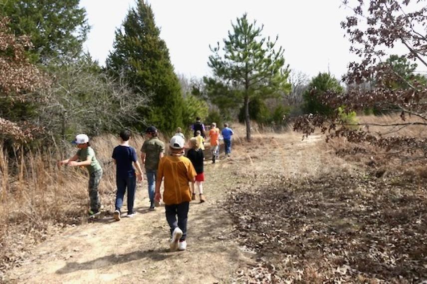 Kids on a nature hike at the Learning Gardens. 