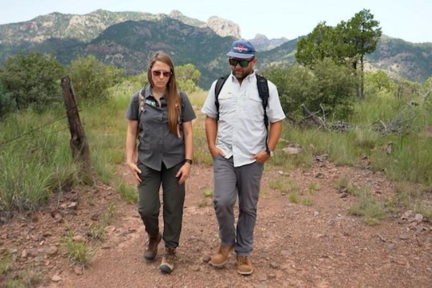 Kaylee French and Chet Garner trek through the Davis Mountains Preserve. 