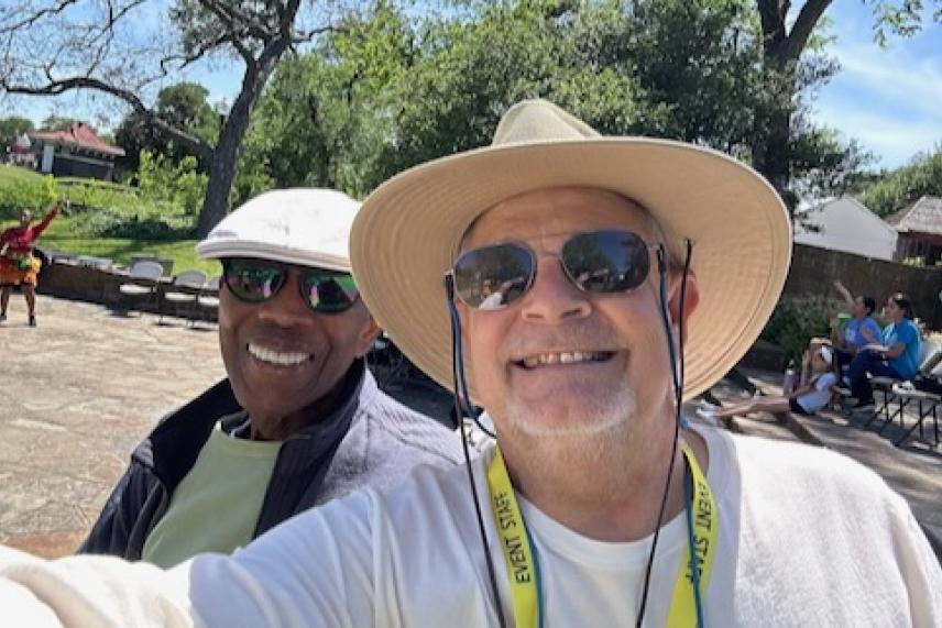 Memnosyne Institute Executive Director Philip Collins and Green Source Texas Director Wendel "Hank" Withrow have fun at the 2026 Oak Cliff Earth Day