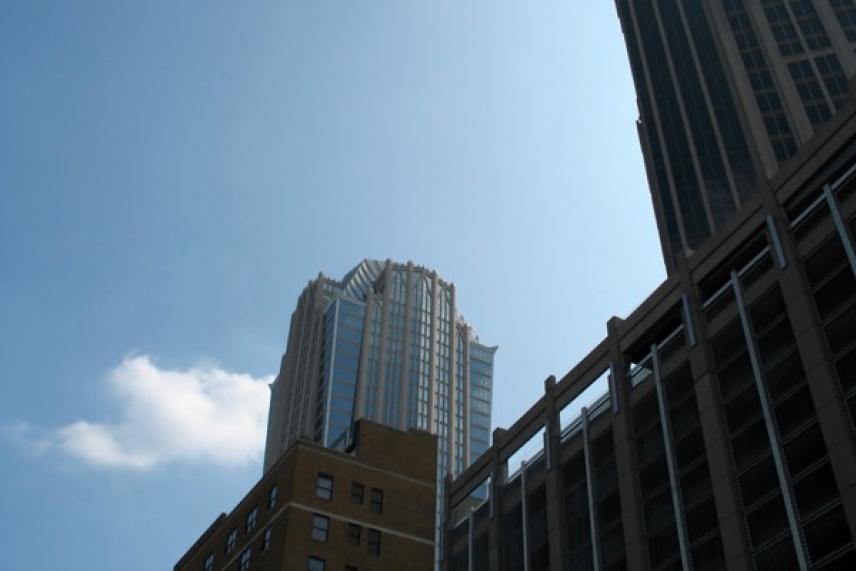 Tall skyscrapers against a clear blue sky.