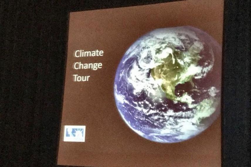 Earth displayed on a screen with "Climate Change Tour" text.