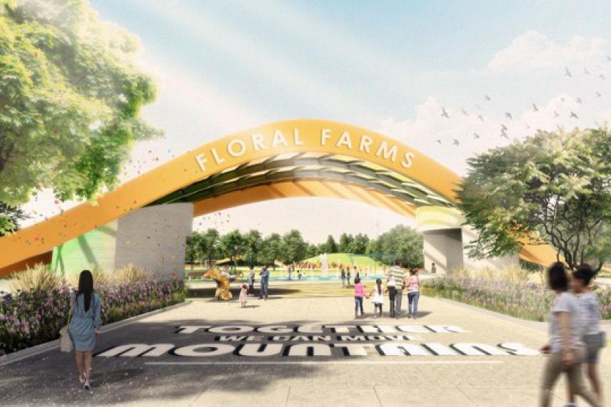 Floral Farms entrance with colorful arch and people walking.