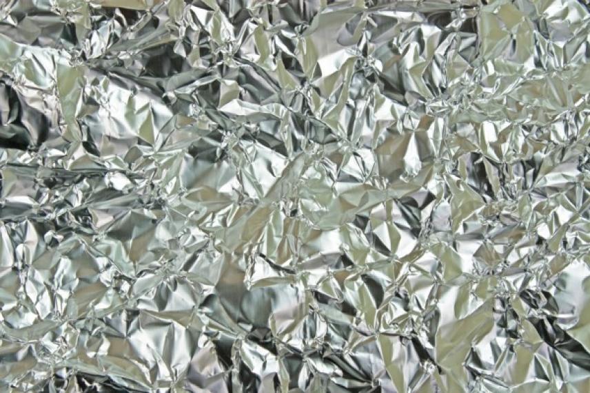 Crinkled silver foil with reflections.