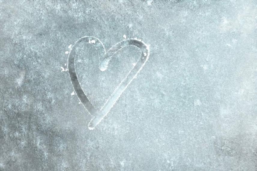 Heart drawn on frosted glass.