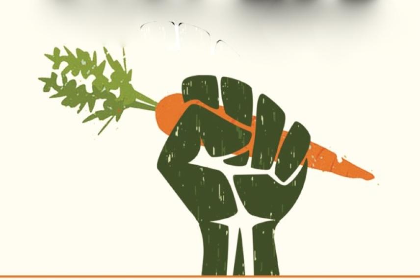 Fist holding a carrot with green leaves emerging on top.