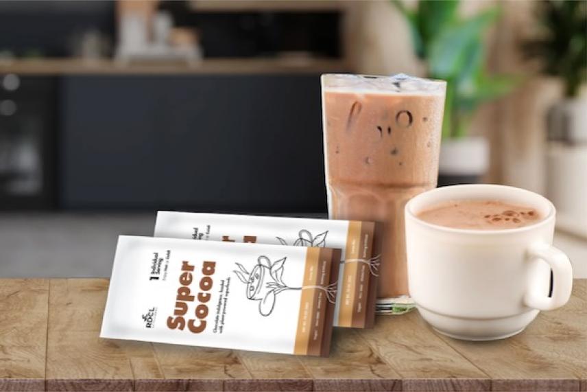 Iced coffee, hot chocolate, and cocoa packets on a wooden table.