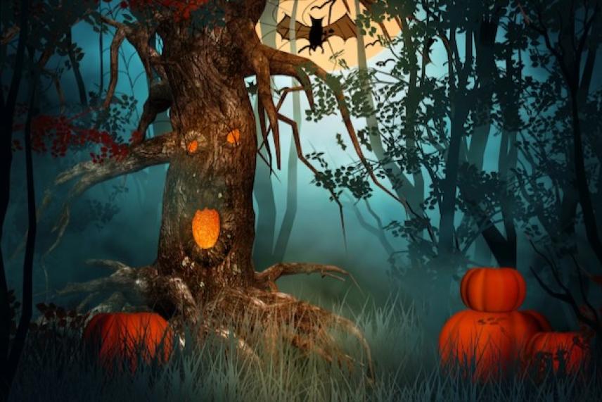 Spooky forest with glowing pumpkins and a gnarled tree under the moonlight.