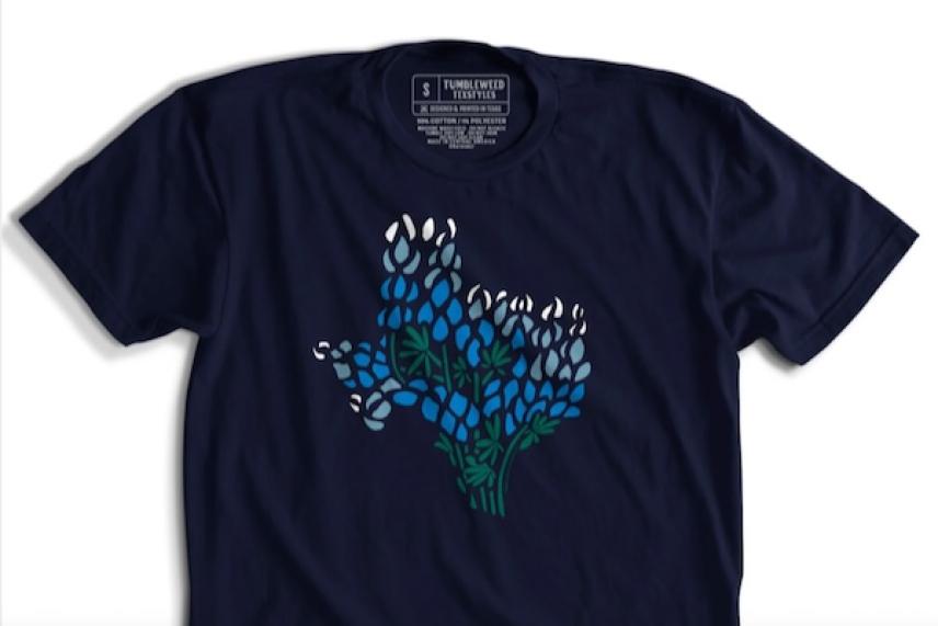 Navy T-shirt with Texas outline in bluebonnet flowers.
