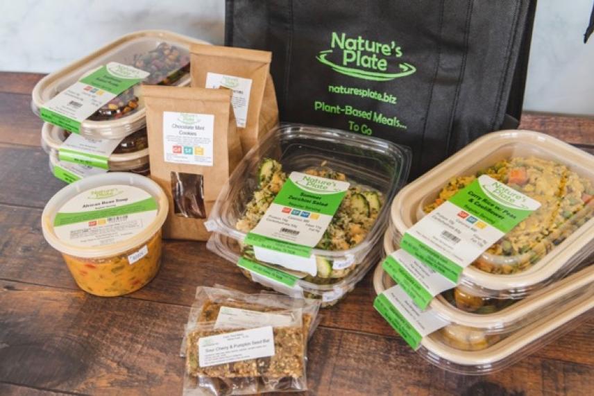 Pre-packaged vegan meals and snacks with a Nature's Plate tote bag.