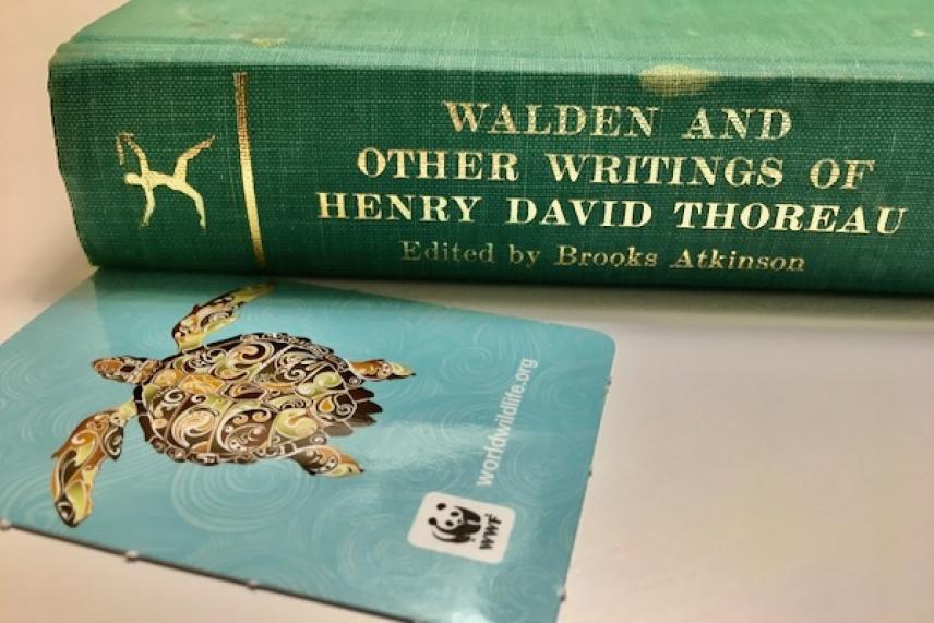 Green book titled "Walden" next to a turtle-themed WWF card.