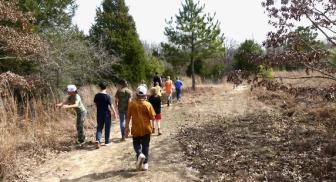 Kids on a nature hike at the Learning Gardens. 