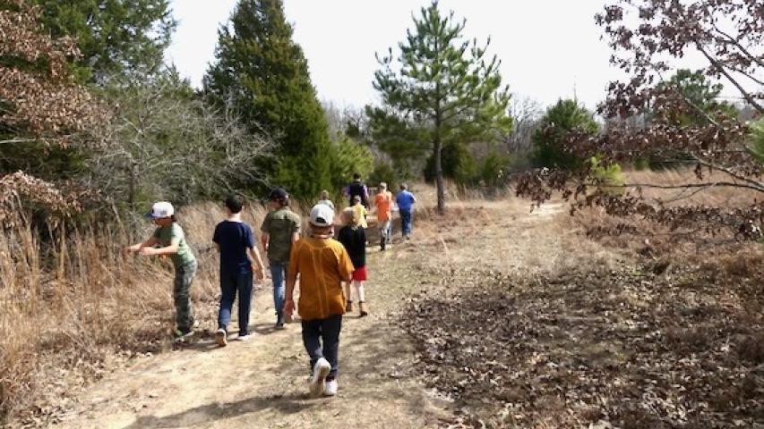 Kids on a nature hike at the Learning Gardens. 