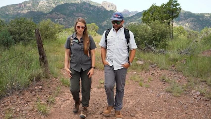 Kaylee French and Chet Garner trek through the Davis Mountains Preserve. 