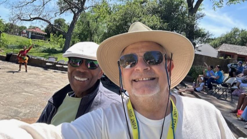 Memnosyne Institute Executive Director Philip Collins and Green Source Texas Director Wendel "Hank" Withrow have fun at the 2026 Oak Cliff Earth Day