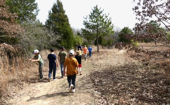 Kids on a nature hike at the Learning Gardens. 