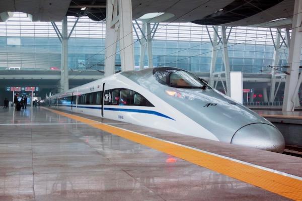 High-speed train at a modern railway station platform.