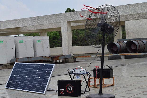 Solar panel and fan setup on rooftop.