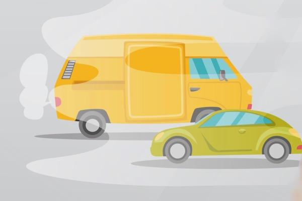 Yellow van and green car on a foggy street.
